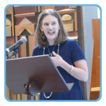 Image of white woman presenting.